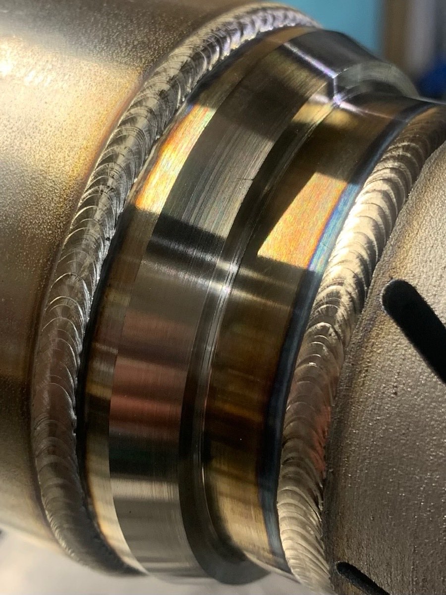 3D printed metal part welded to a stainless machined part and pipe